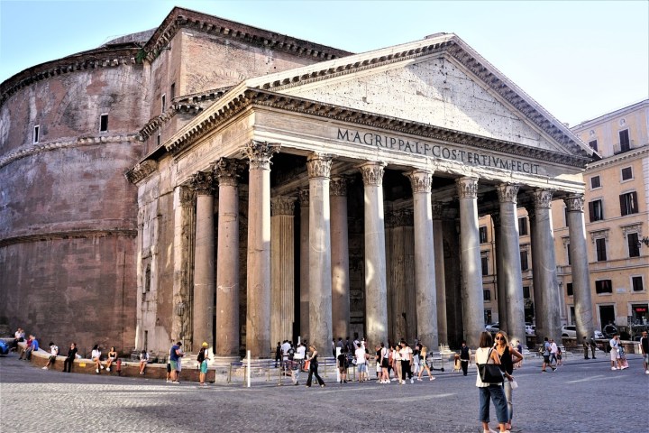 a group of people standing in front of Pantheon, Rome