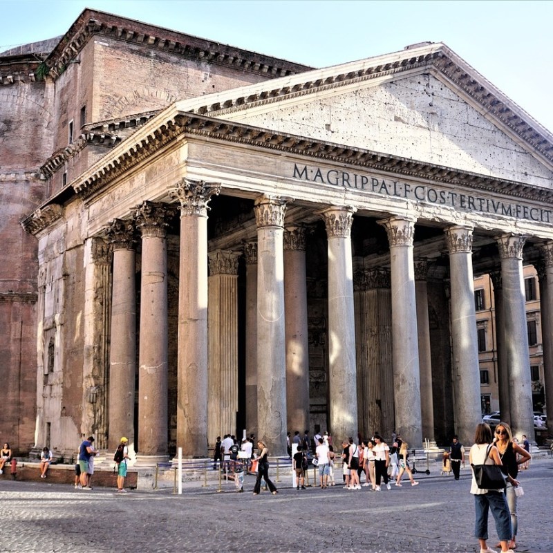 a group of people standing in front of Pantheon, Rome