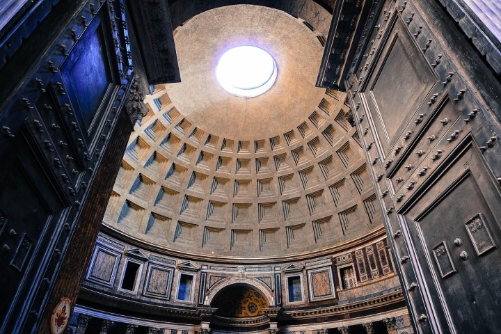 a large building in the background with Pantheon, Rome in the background