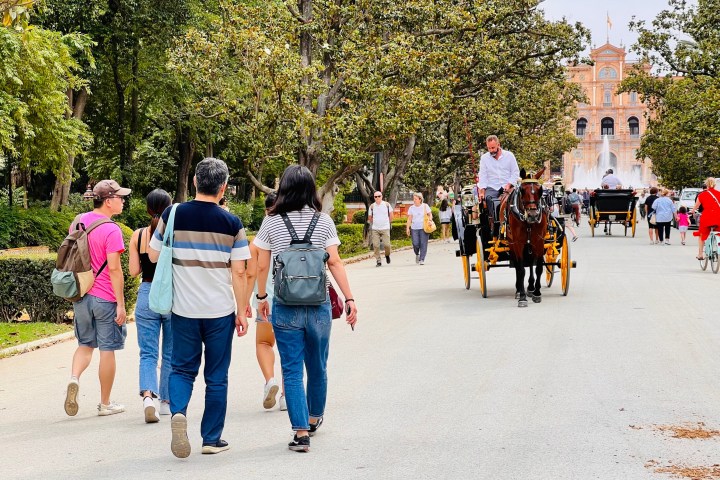 a group of people walking down the street