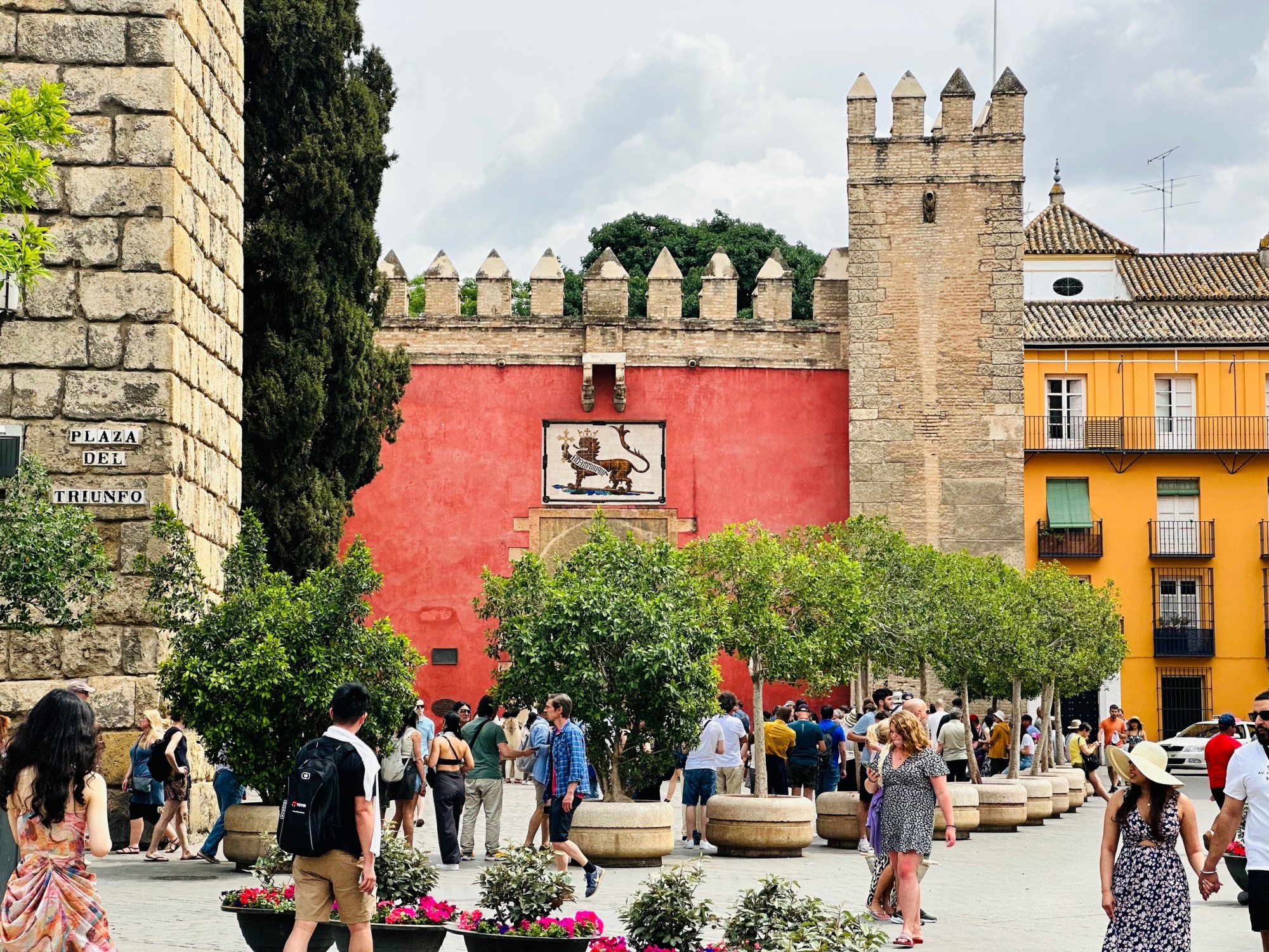 a group of people walking in front of a building
