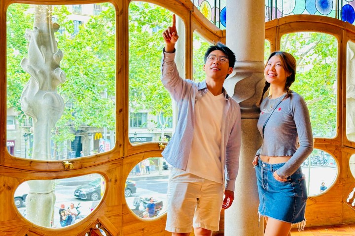 a group of people standing in front of a window