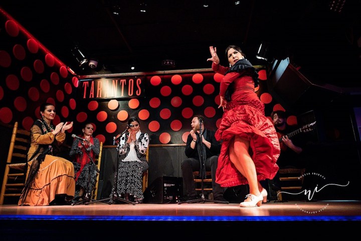a man sitting on a stage