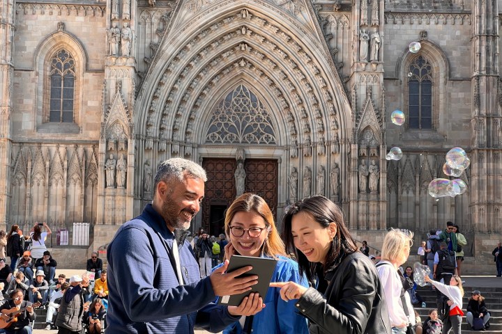 a man and a woman standing in front of a building