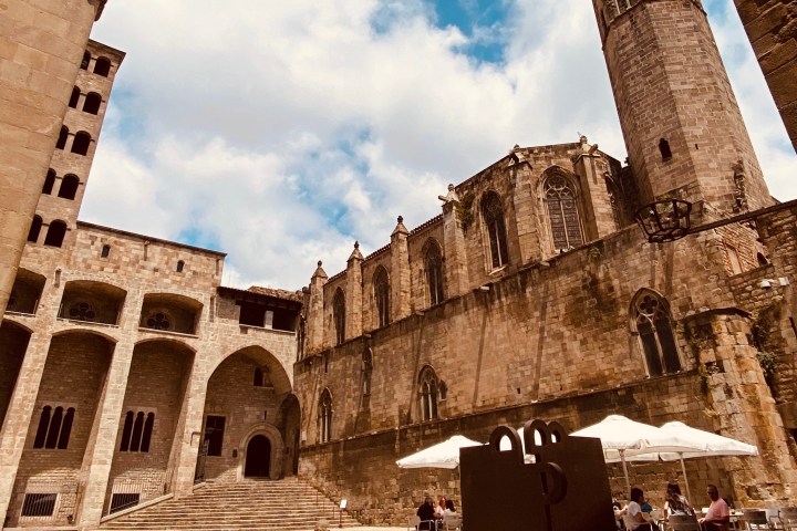 a group of people in front of a castle