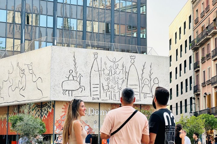 a group of people standing in front of a building