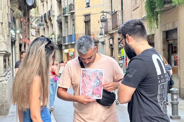 a man standing on a sidewalk