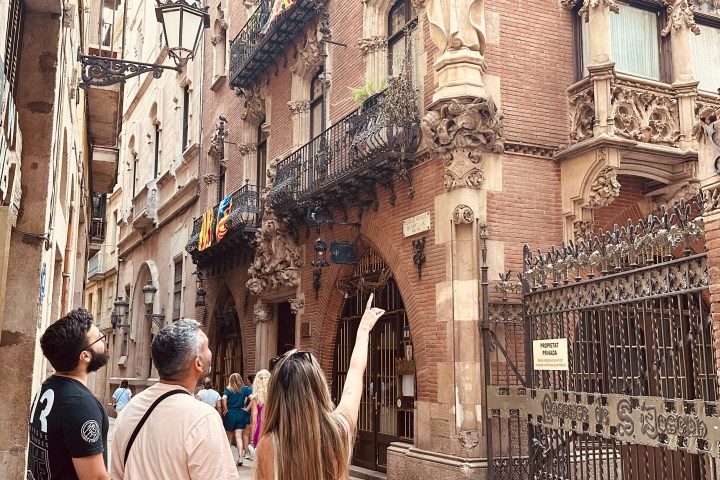 a group of people walking in front of a building