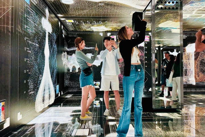 a couple of people that are standing in the rain