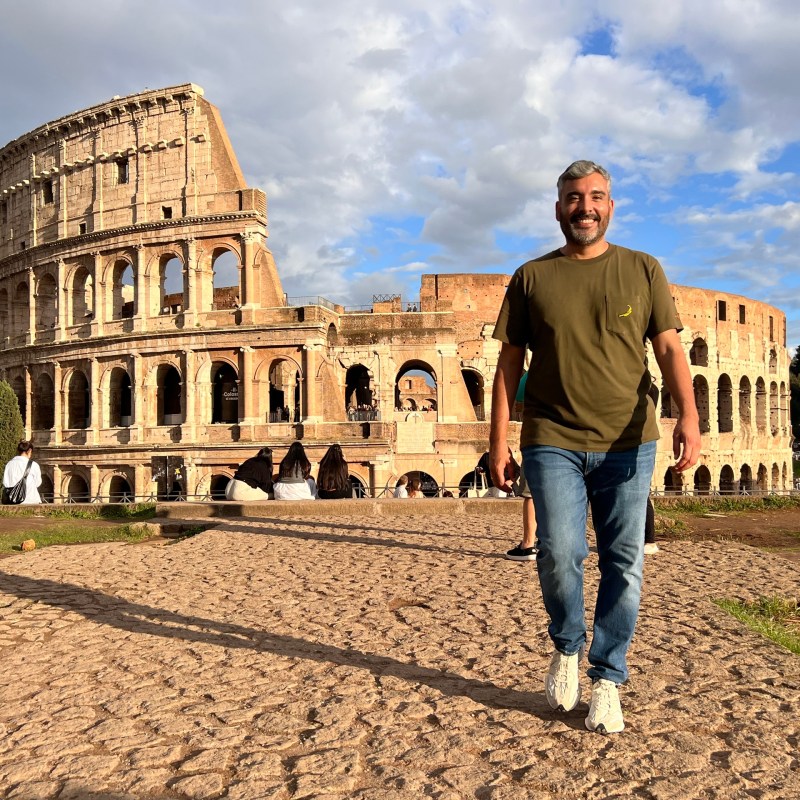 a man standing in front of a castle