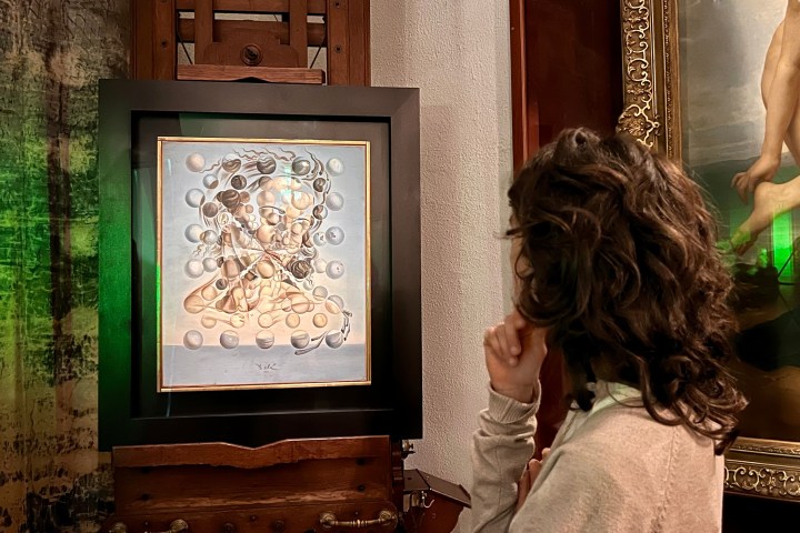 a person standing in front of a television