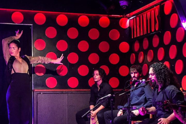 Flamenco dancers and singers performing on stage