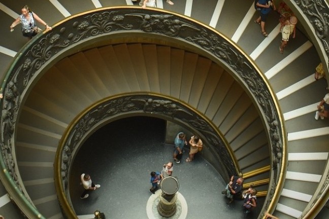 a large clock hanging off the side of a building