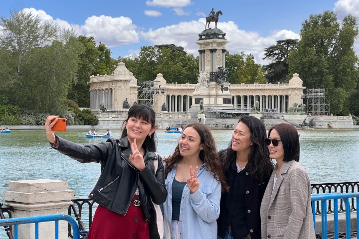 a man and a woman standing in front of a building