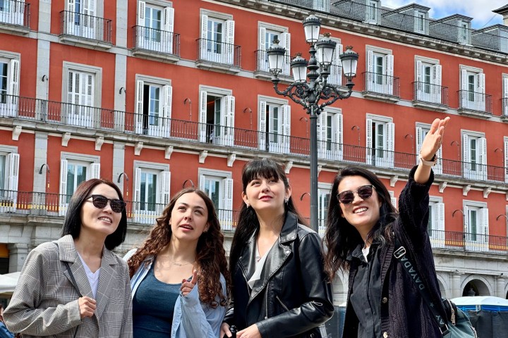 a group of people standing in front of a building