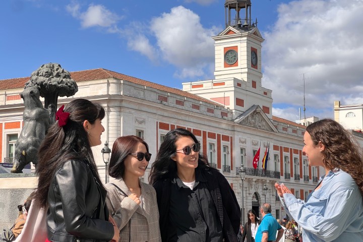 a group of people standing in front of a building
