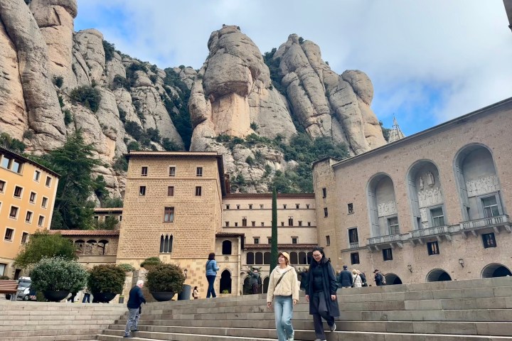 a group of people walking in front of Montserrat