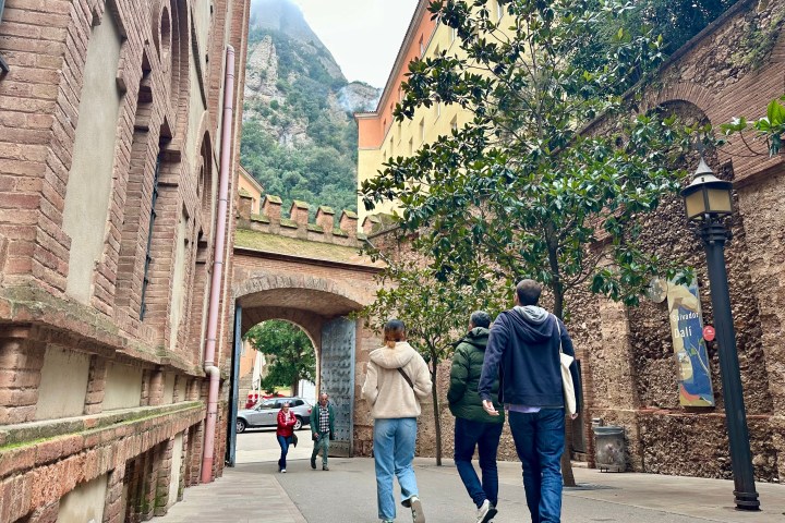 a group of people walking on a bridge