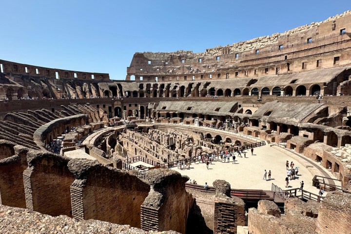 a group of people in front of Colosseum