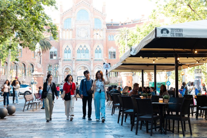 a group of people standing in front of a building