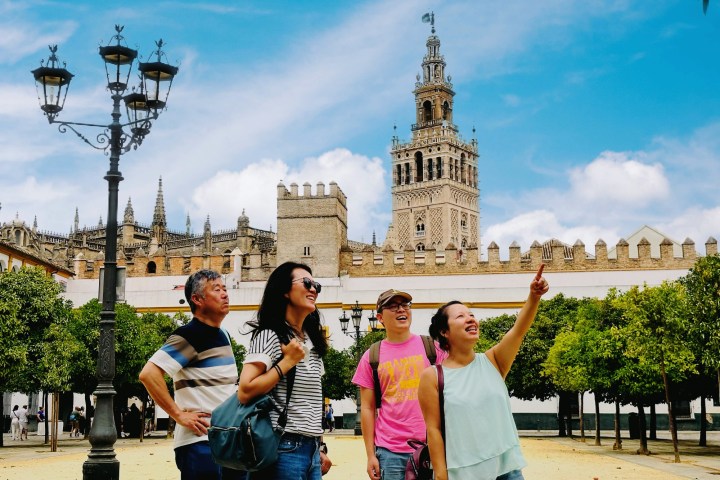 a group of people standing in front of a building
