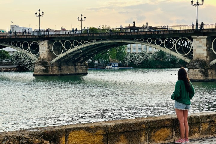 a train crossing a bridge over a river