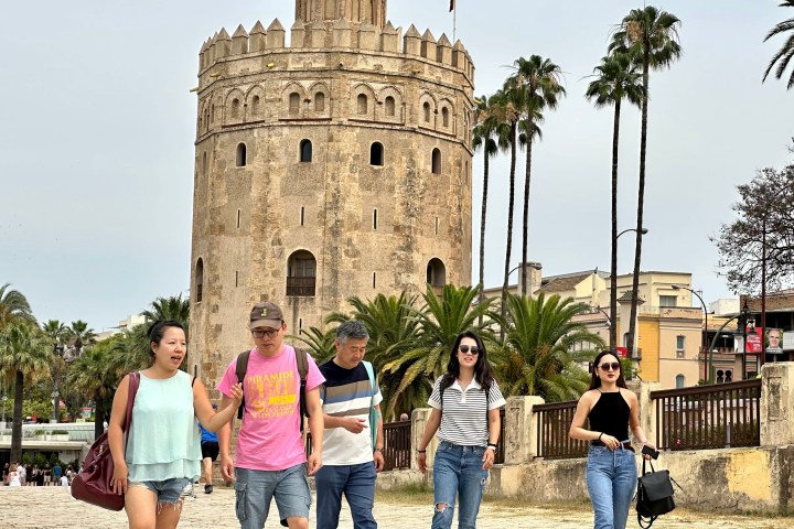 a group of people standing in front of a building