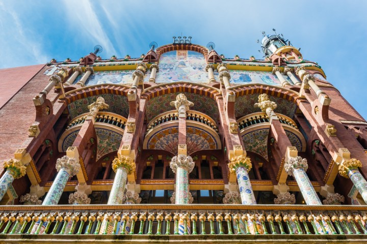 a person standing in front of Palau de la Música Catalana