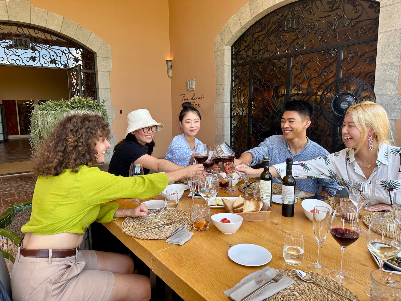 a group of people sitting at a lunch table
