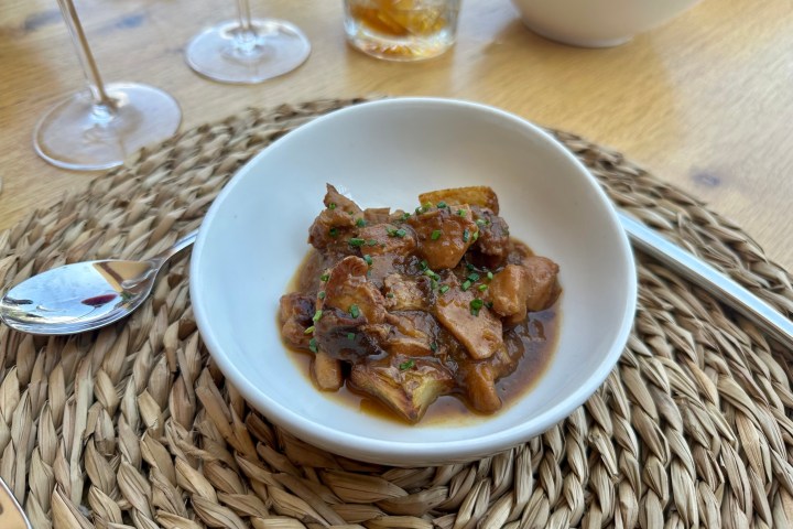 a bowl of food on a plate on a table