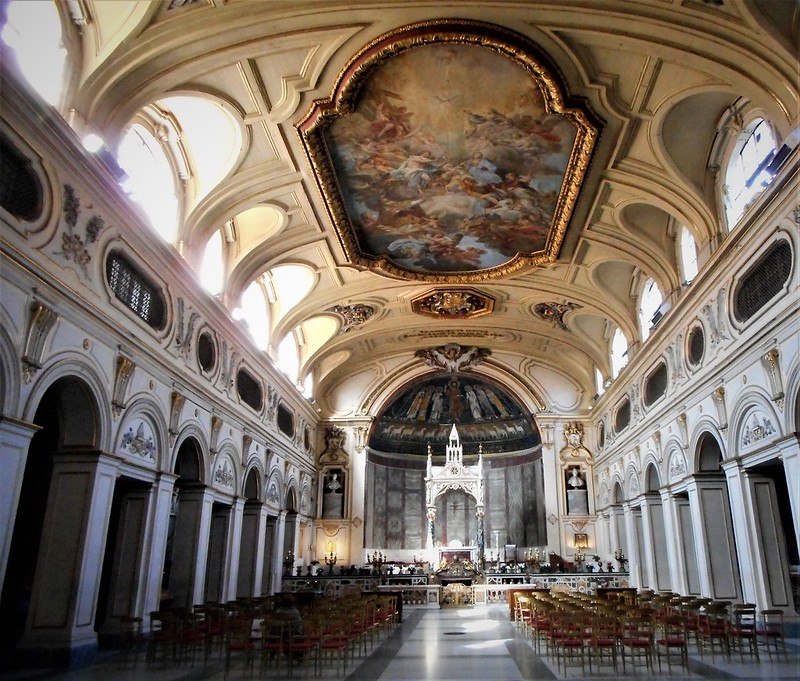 Ornate cathedral interior with arched ceilings and decorative walls - Basilica of Santa Cecilia in Trastevere