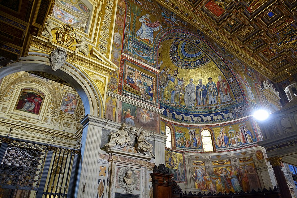 Ornate Santa Marie in Trastevere church interior with gold mosaics, arches, religious figures, and paintings.