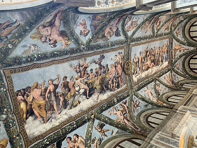 Ornate ceiling mural with mythological scenes and figures in a grand hall - Raphael's fresco Cupid and Psyche in Villa Farnesina