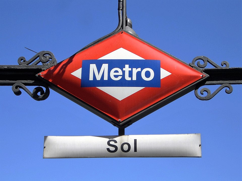 Metro sign for Sol station on a blue sky background.