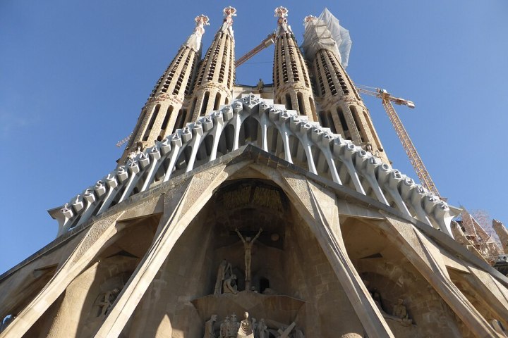 The Passion Facade of the Sagrada Familia in Barcelona, showing the austere and skeletal stone sculptures by Josep Maria Subirachs.