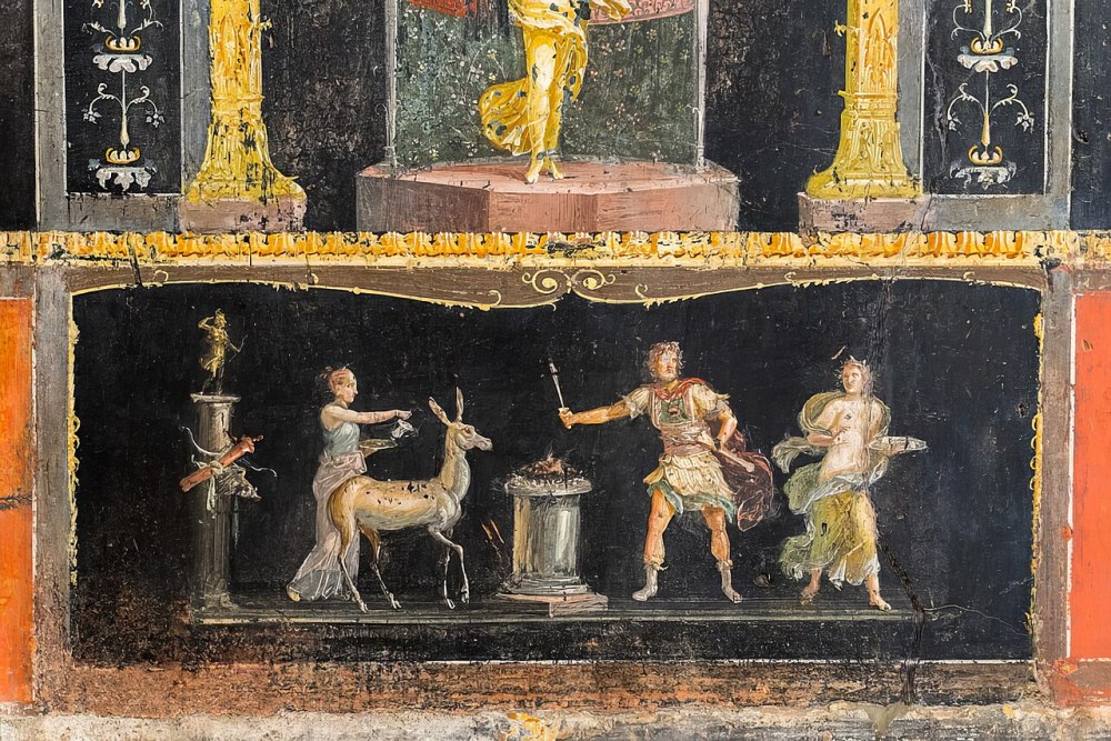 Ancient fresco depicting three figures with a deer and a pedestal, framed by decorative columns.