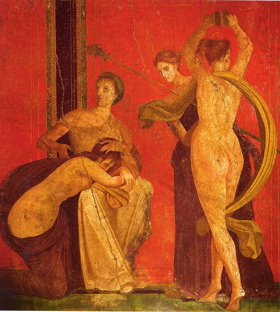 Ancient fresco with three women on a red background; one seated, one kneeling, and one standing.