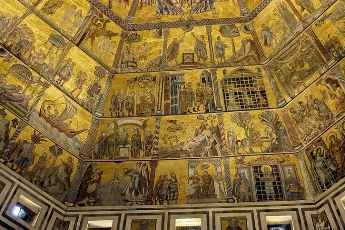 Interior of a dome with intricate golden mosaics depicting religious scenes and figures under a central skylight.