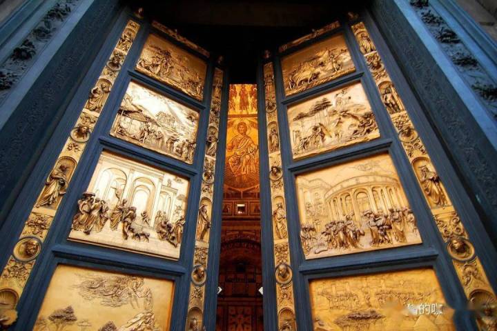 Golden ornate doors with biblical scenes and a religious figure visible inside.