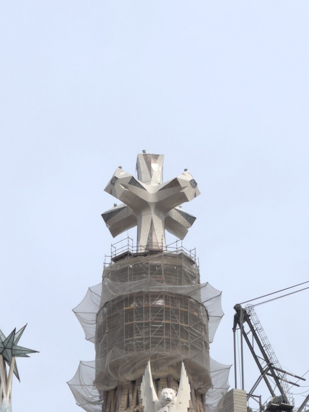 Top of a building under construction with a unique star-shaped structure.