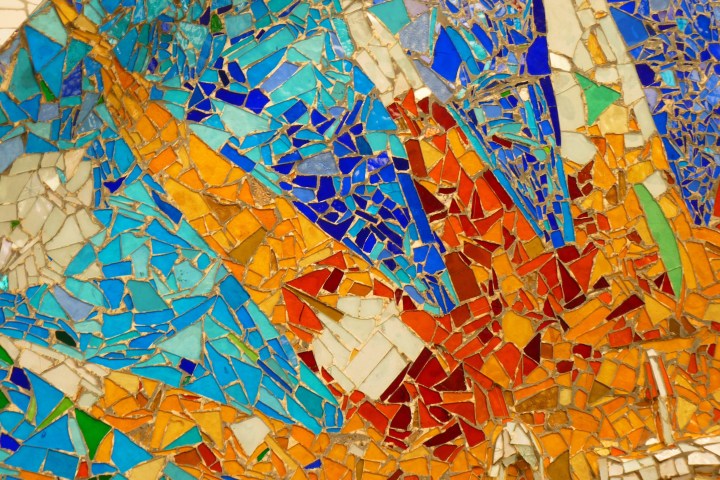 Colorful mosaic with orange, blue, and yellow tiles.